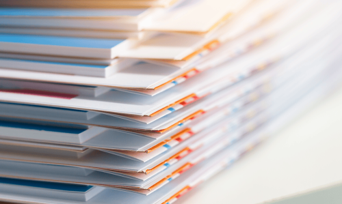 Stack of report paper documents