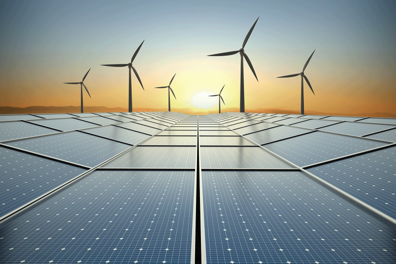 clean energy concept solar power and wind turbines