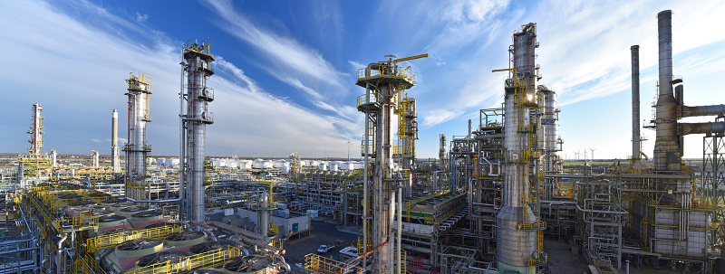 pipeline, storage tanks and buildings of a refinery